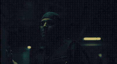 Person In Dark Room With Hand Out GIF