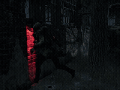 Person In Dark Room With Red Light Behind GIF