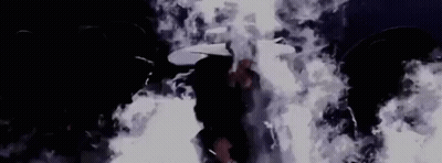 Person In Dark Room With Smoke From Ceiling GIF