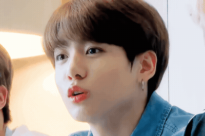 Person In Denim Shirt And Earrings Close Up GIF