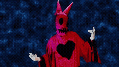 Person In Devil Costume With Heart GIF