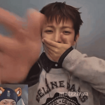 Person In Feline Sweater Covering Mouth GIF