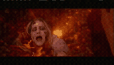Person In Fire With Hands Outstretched Movie Scene GIF