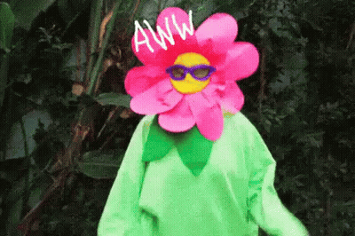 Person In Flower Costume And Sunglasses In Woods GIF