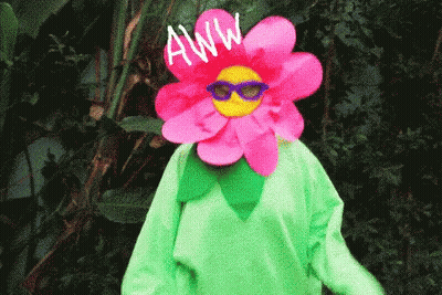 Person In Flower Costume Saying Aww GIF