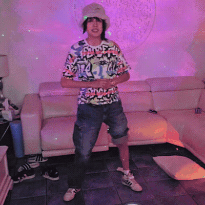 Person In Front Of Couch Wearing Swag Shirt GIF