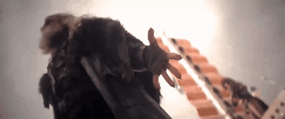 Person In Fur Coat Reaching For Ladder GIF