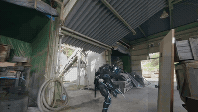 Person In Futuristic Suit Standing In Building GIF