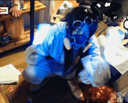 Person In Gas Mask Kneeling In Front Of Sign Saying T GIF