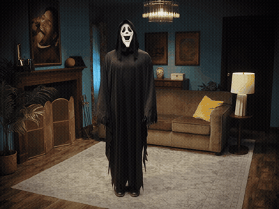 Person In Ghost Costume Beside Couch GIF