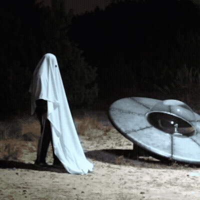 Person In Ghost Costume Next To Gray Object GIF