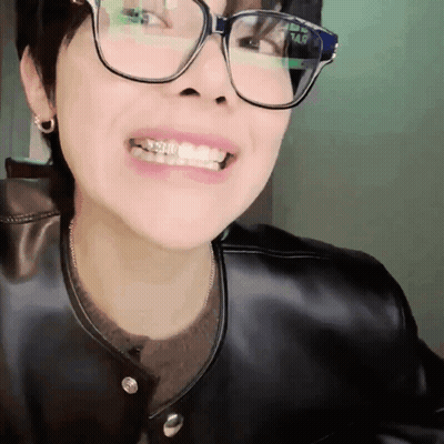 Person In Glasses And Black Leather Jacket GIF