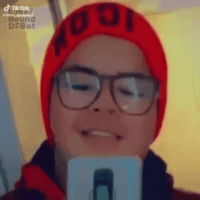 Person In Glasses And Red Hat Taking Selfie GIF