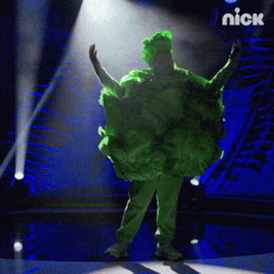 Person In Green Cabbage Costume On Stage With Nick Logo GIF
