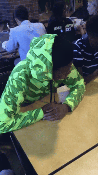 Person In Green Hoodie Saying Make GIF