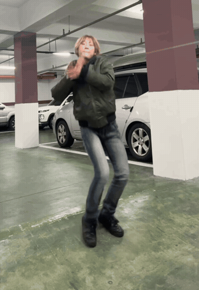 Person In Green Jacket Dancing GIF