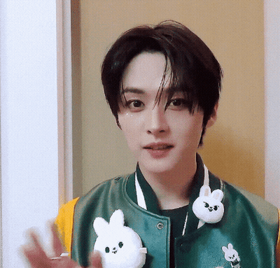 Person In Green Jacket With Bunny GIF