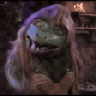Person In Green Mask And Wig GIF