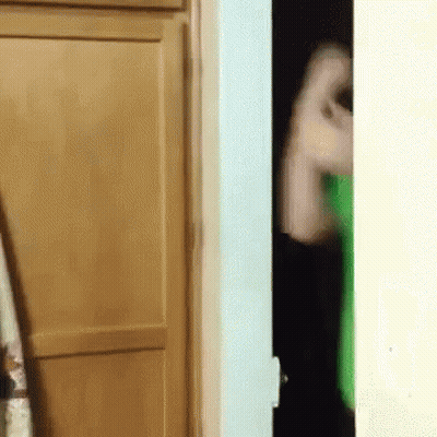 Person In Green Shirt Holding Toilet Paper GIF