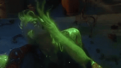Person In Green Suit Eating Because Bored GIF