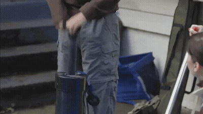 Person in Grey Cargo Pants With Blue Bag