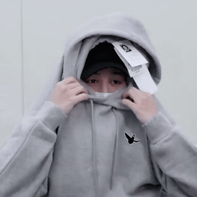 Person In Grey Hoodie Covering Face GIF