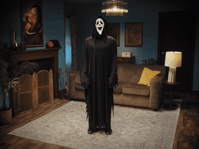 Person In Grim Reaper Costume In Living Room GIF