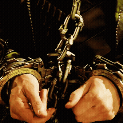 Person In Handcuffs Labeled Prisoner GIF