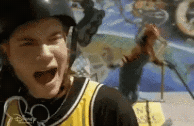 Person In Helmet And Yellow Black Jersey Screaming GIF