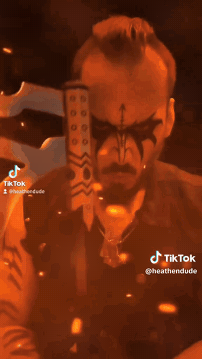 Person In Helmet Holding Axe With TikTok GIF