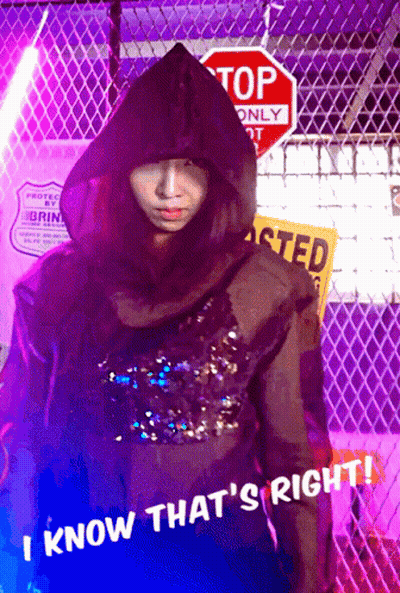 Person In Hooded Jacket At Stop Sign GIF