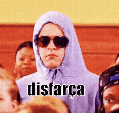 Person In Hoodie And Sunglasses Says Disfarca In Crowd GIF