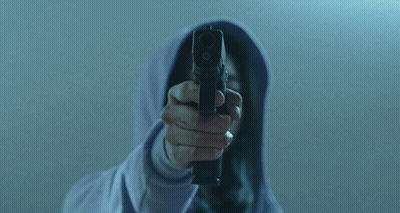 Person In Hoodie Holding Gun To Face GIF