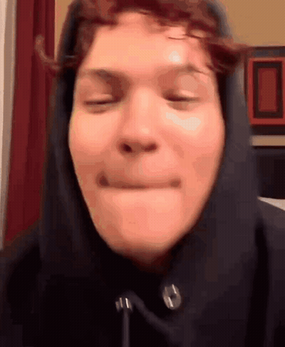 Person In Hoodie Making Face GIF
