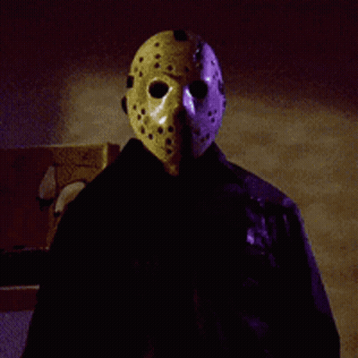 Person In Jason Voorhees Mask And Black Jacket GIF