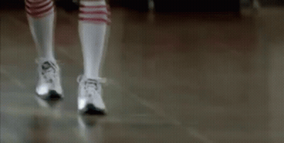 Person in Knee High Socks and Sneakers Walking