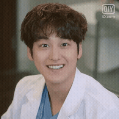Person In Lab Coat Smiling GIF