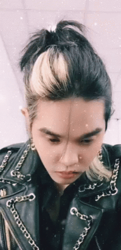 Person In Leather Jacket With Chains GIF