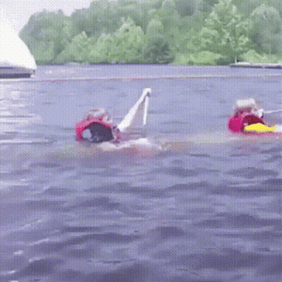 Person In Life Vest Floating On Raft GIF