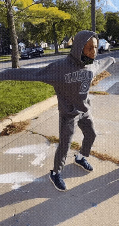 Person In Mackinac Sweatshirt On Sidewalk GIF