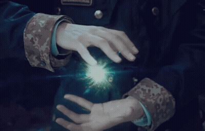 Person In Military Uniform Holding Light GIF