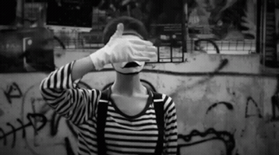 Person In Mime Mask Covering Eyes GIF