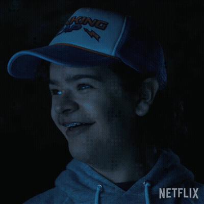 Person In Netflix Hoodie And Trucker Hat GIF