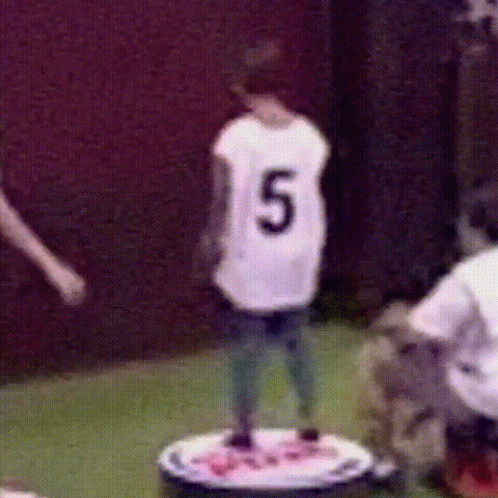 Person In Number 5 Jersey Standing On Table GIF