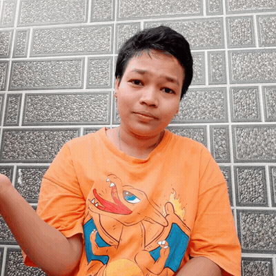 Person In Orange Shirt With Cartoon Character GIF