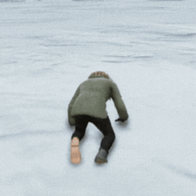 Person In Parka Walking On Snow GIF