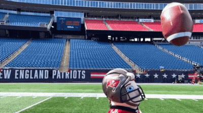 Person In Patriots Helmet Throwing Football GIF