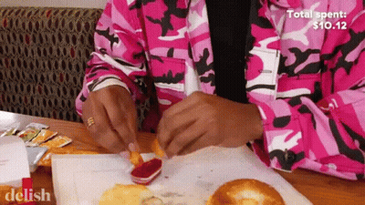 Person In Pink Camo Jacket Dipping Fries In Ketchup GIF