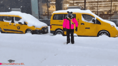 Person In Pink Jacket In Front Of Yellow NYC Taxi GIF