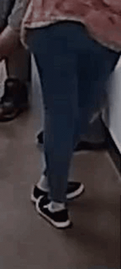 Person In Pink Shirt Walking On Subway GIF